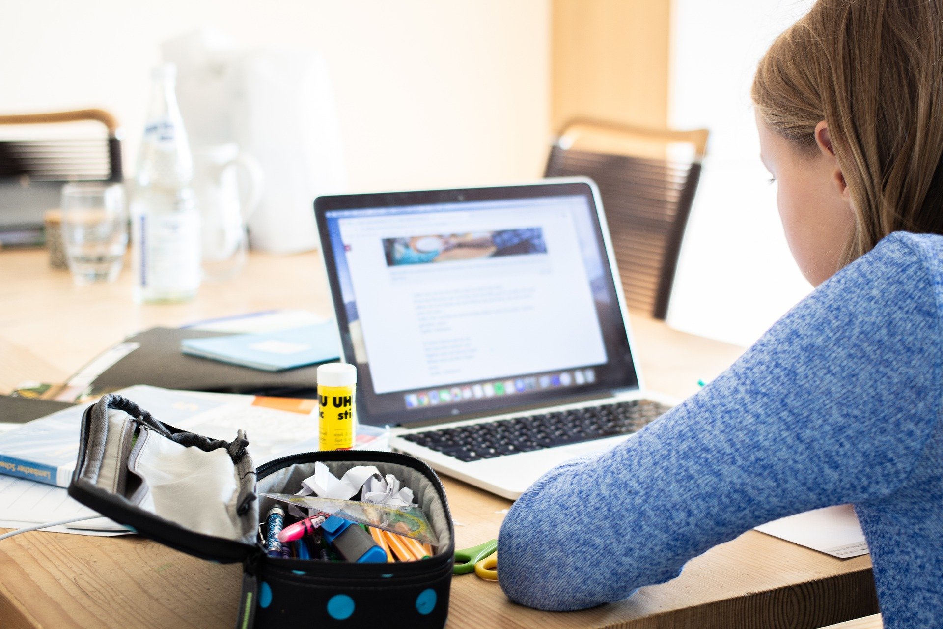 girl sitting in front of a laptop